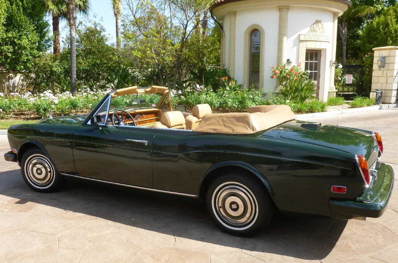 Green 1983 Rolls Royce Corniche Convertible exterior with convertible roof for Rolls-Royce car rental in California