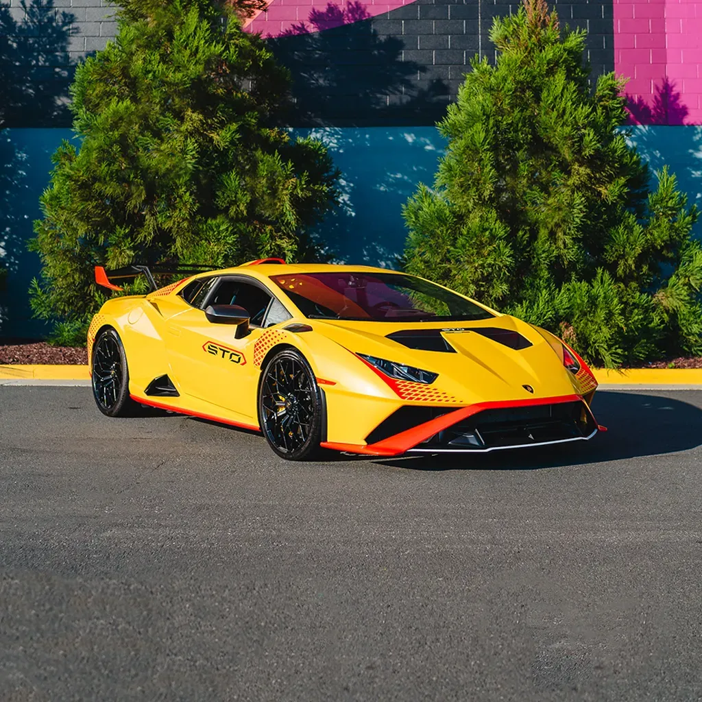 Orange 2023 Lamborghini Super Trofeo Omologata for exotic car rental