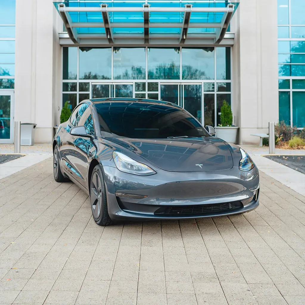 Gray 2023 Tesla Model 3 Long Range for black car service in Whittemore, MI
