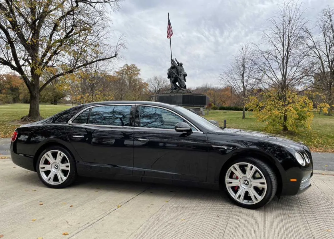 Black Bentley Flying Spur exterior, photo 3 for luxury car rental
