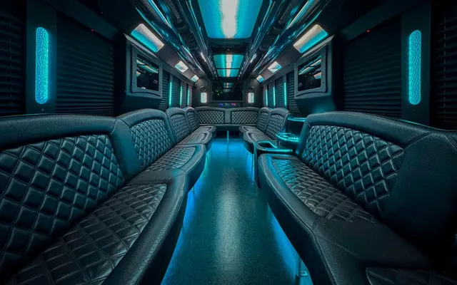 Ford F-550 Party Bus interior with perimeter lounge seating, window shades and LED accent lighting for party bus rental Ford F-550 Party Bus interior with perimeter lounge seating, window shades and LED accent lighting for party bus rental