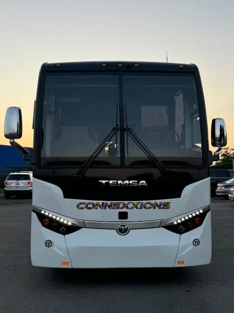White 56 Passenger Charter Bus exterior for charter bus rental in Ocoee, FL