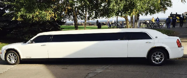 White C300 Limousine exterior with tinted windows for limo rental in North Dakota