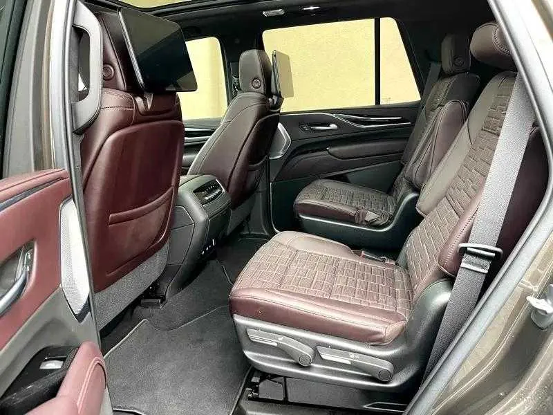 Cadillac Escalade ESV interior with captain's chairs and rear-seat entertainment screens for airport transfers Cadillac Escalade ESV interior with captain's chairs and rear-seat entertainment screens for airport transfers