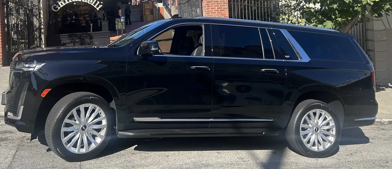 Black Cadillac Escalade exterior for airport transfers in Moss Beach, CA