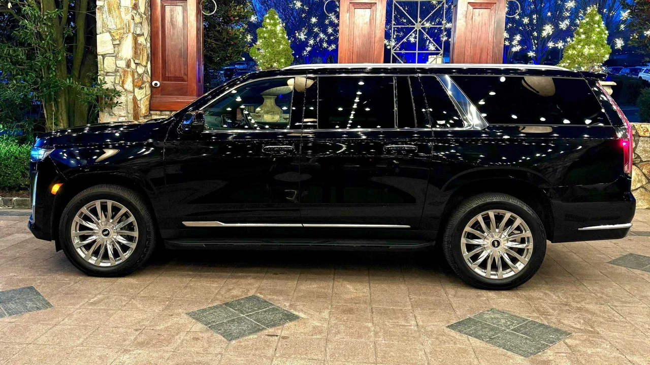 Black Cadillac Escalade with tinted windows for airport transfers