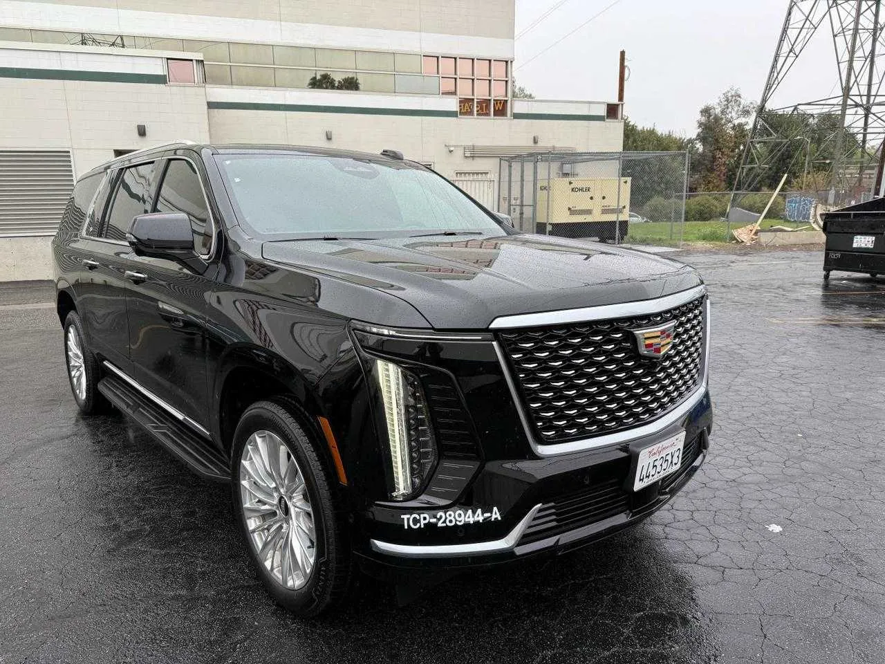 Black Cadillac Escalade with running boards for airport transfers Black Cadillac Escalade with running boards for airport transfers