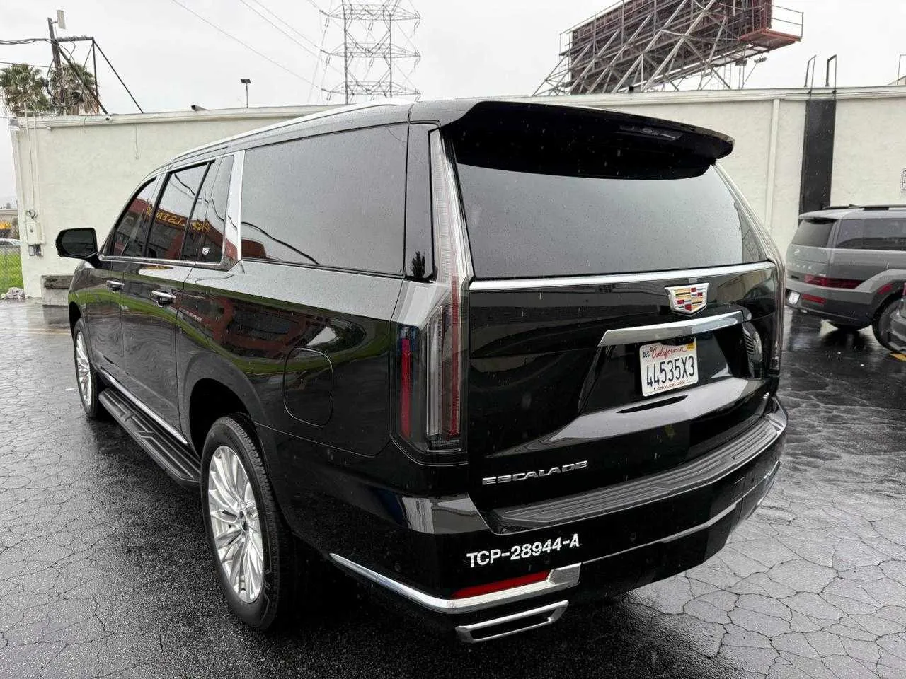 Black Cadillac Escalade exterior with running boards for airport transfers