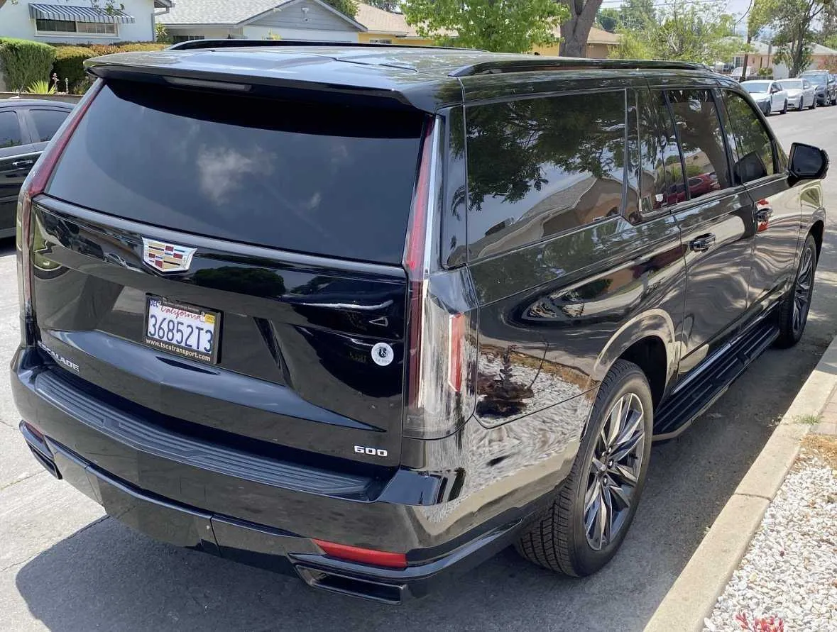 Black Cadillac Escalade with tinted windows and running boards for airport transfers in Venice, CA