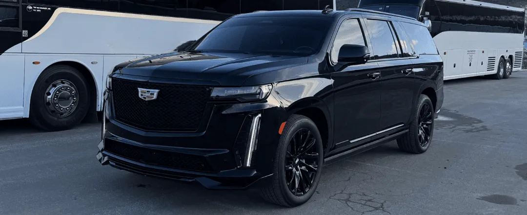 Black Cadillac Escalade with tinted windows and running boards for airport transfers in Brisbane, CA