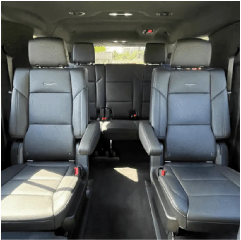 Cadillac Escalade interior with captain's chairs for airport transfers