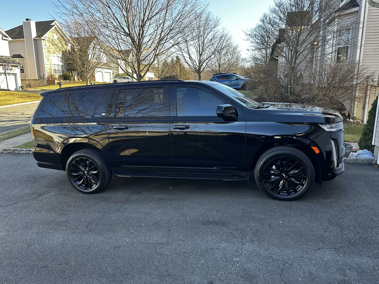 Black Cadillac Escalade exterior with tinted windows, photo 4 for airport transfers Black Cadillac Escalade exterior with tinted windows, photo 4 for airport transfers