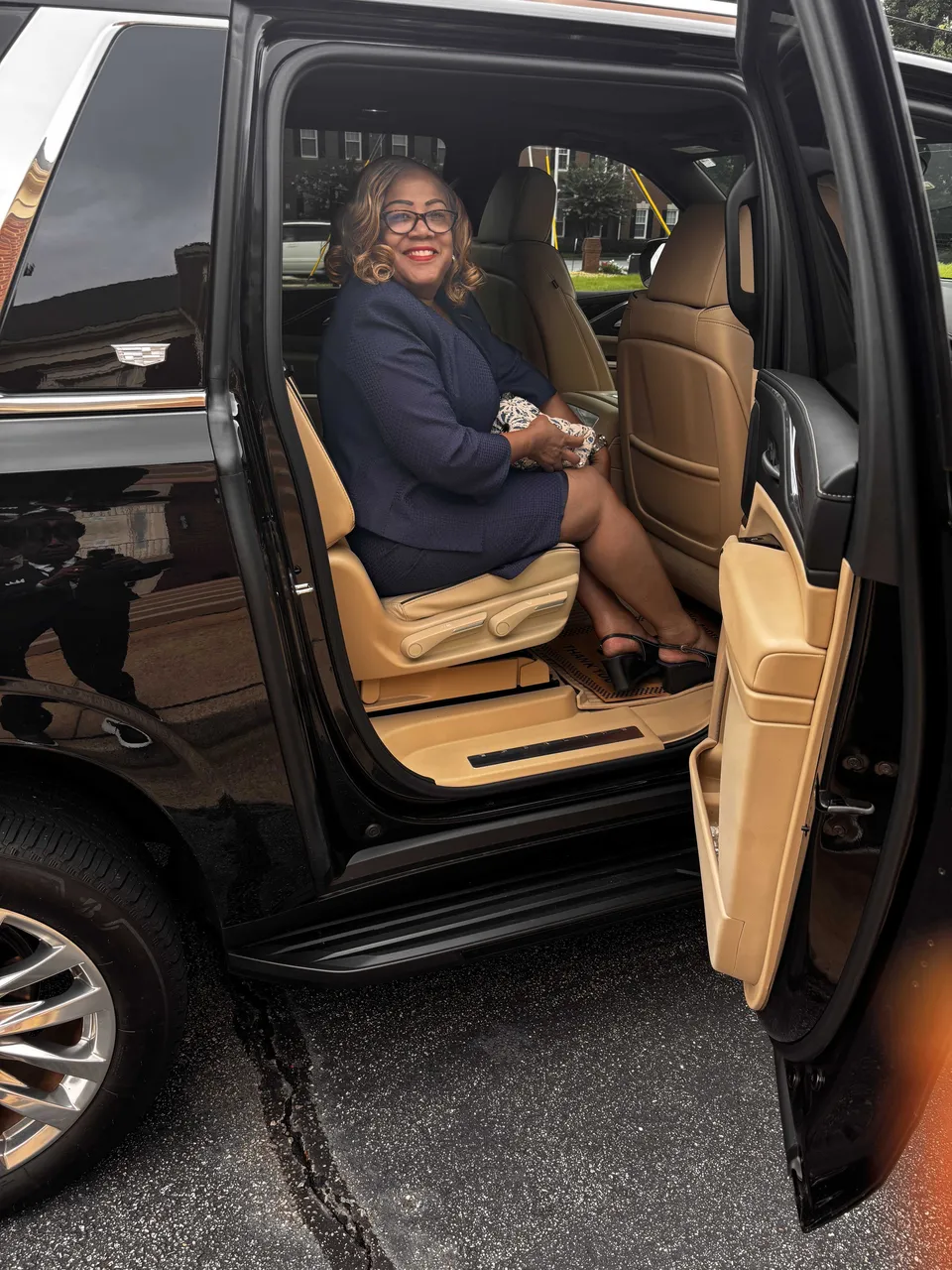 Cadillac Escalade interior with running boards for airport transfers