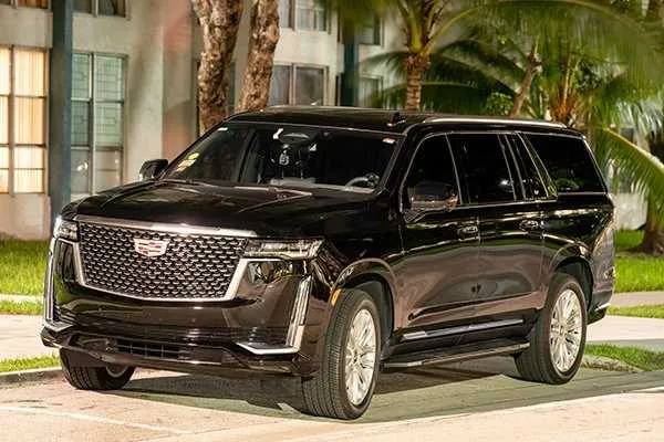 Black Cadillac Escalade with tinted windows for airport transfers