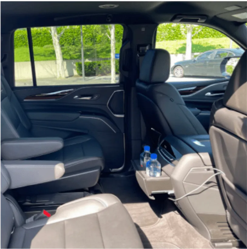 Cadillac Escalade interior with captain's chairs and cup holders for airport transfers Cadillac Escalade interior with captain's chairs and cup holders for airport transfers