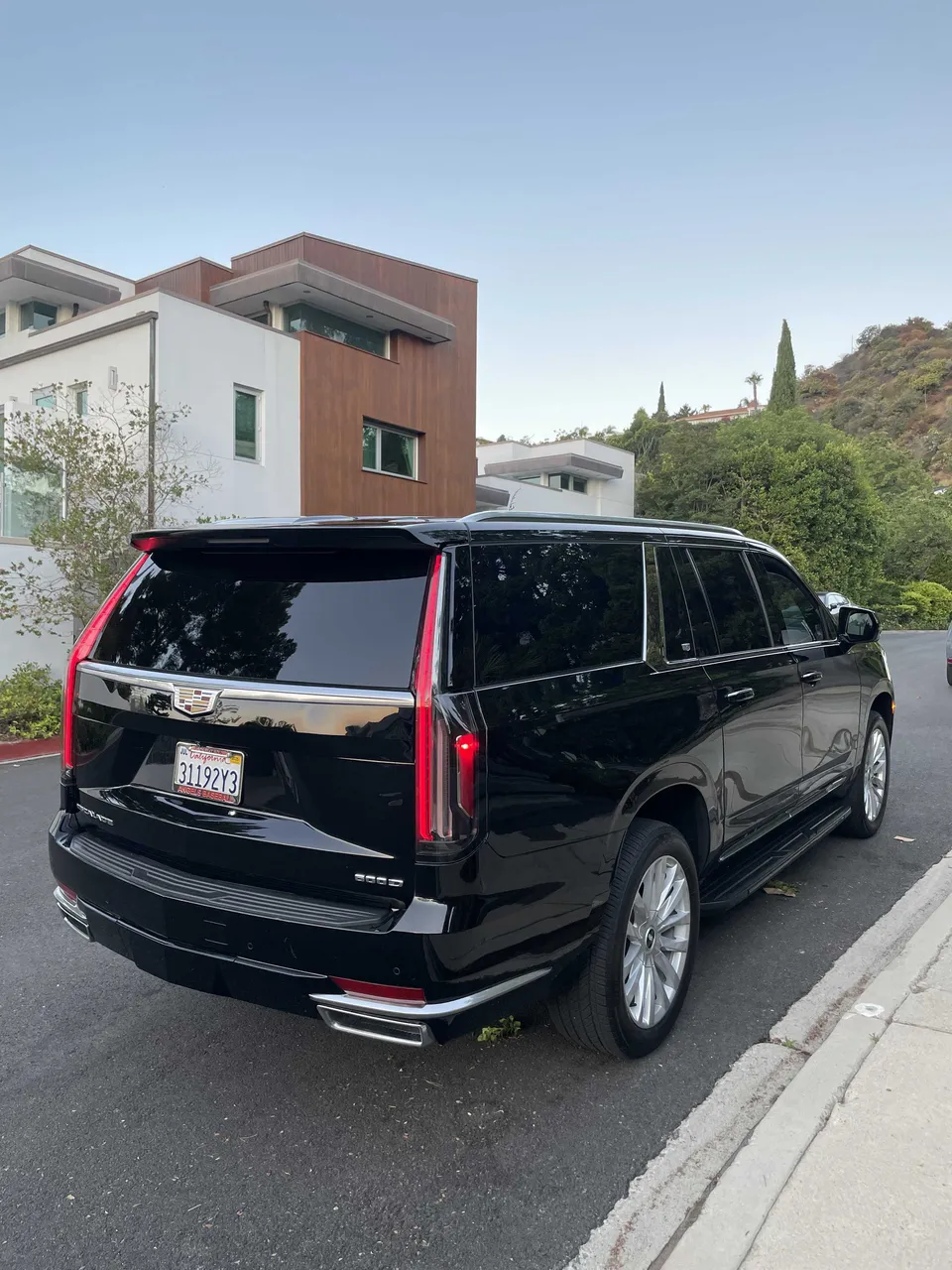 Black Cadillac Escalade exterior with tinted windows and running boards, photo 7 for cadillac escalade limo in Beverly Hills, CA