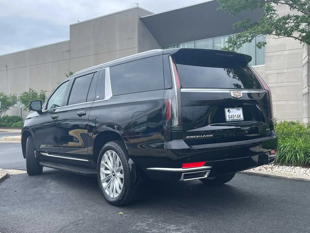 Black Cadillac Escalade exterior with running boards for airport transfers