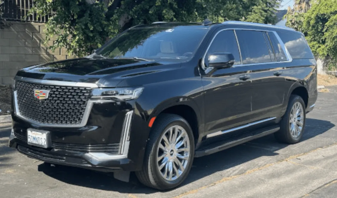 Black Cadillac Escalade with running boards for airport transfers in Tujunga, CA