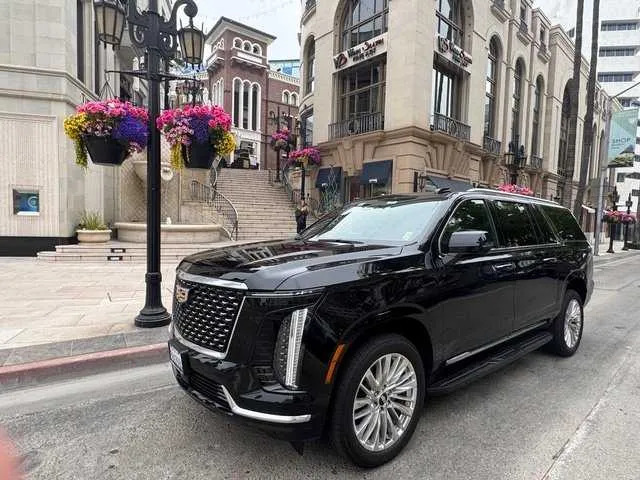 Black Cadillac Escalade with running boards for black car service in Los Angeles County, CA Black Cadillac Escalade with running boards for black car service in Los Angeles County, CA