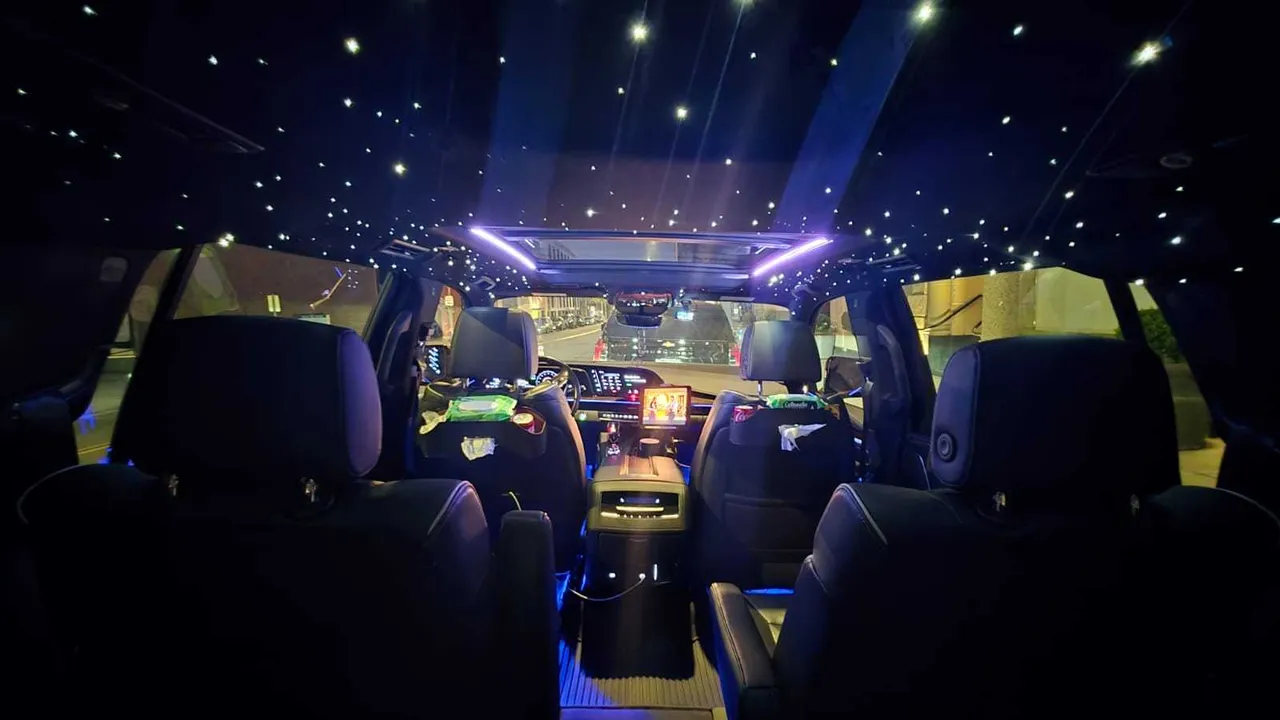 Cadillac escalade interior with LED accent lighting and starlight or fiber-optic ceiling for airport transfers in Summerland, CA