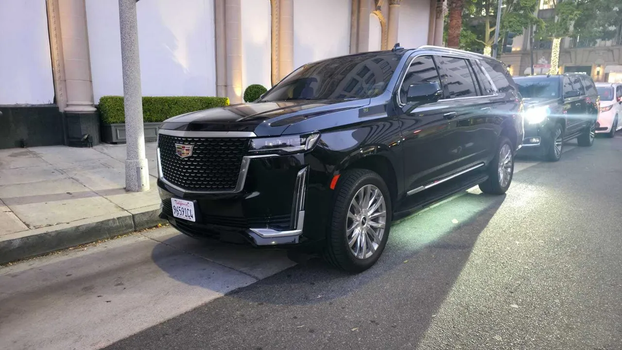 Black Cadillac escalade exterior with tinted windows for airport transfers in Summerland, CA