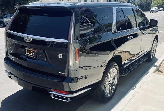 Black Cadillac Escalade with running boards for airport transfers Black Cadillac Escalade with running boards for airport transfers