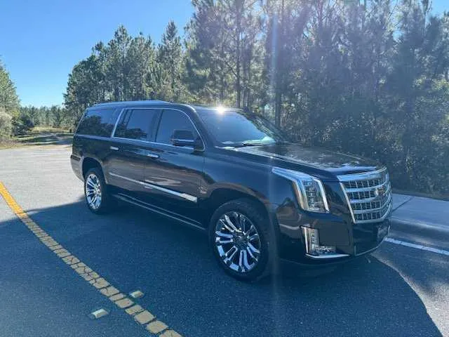 Black Cadillac Escalade (Big Daddy Caddy) exterior with running boards for airport transfers