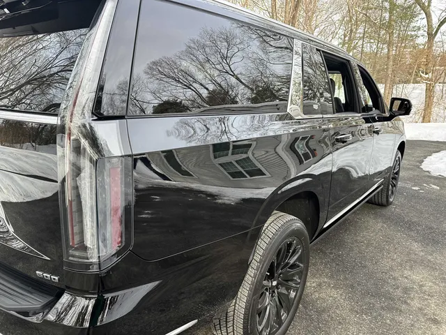 Black Cadillac Escalade ESV exterior with tinted windows for airport transfers Black Cadillac Escalade ESV exterior with tinted windows for airport transfers