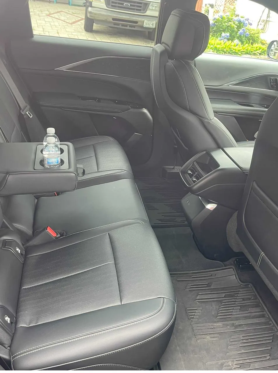 Cadillac Lyriq interior with cup holders for airport transfers Cadillac Lyriq interior with cup holders for airport transfers