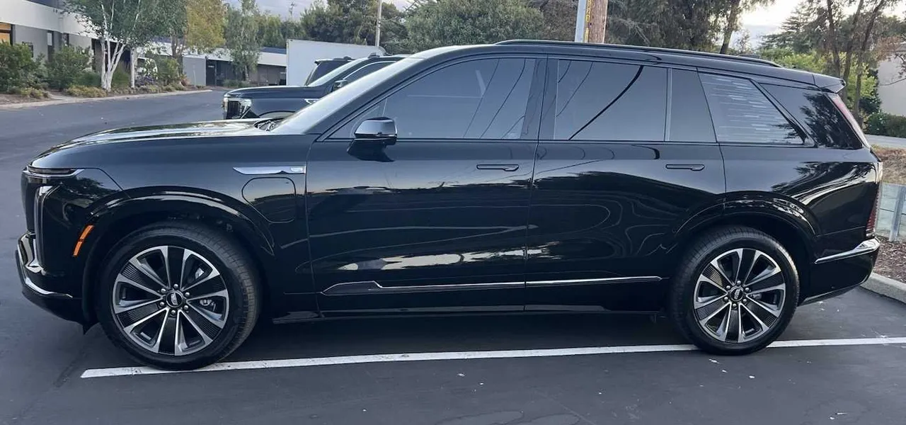 Black CADILLAC Vistiq EV with tinted windows for airport transfers in Montara, CA