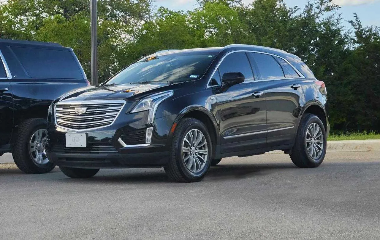 Black Cadillac XT5 for airport transfers in Blanco County, TX