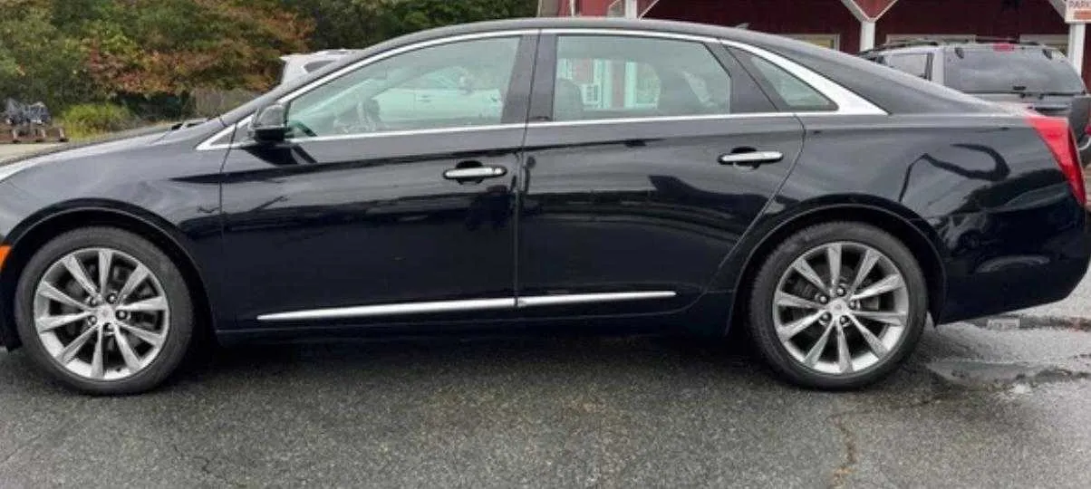 Black Cadillac XTS for sedan rental in Mapleville, RI