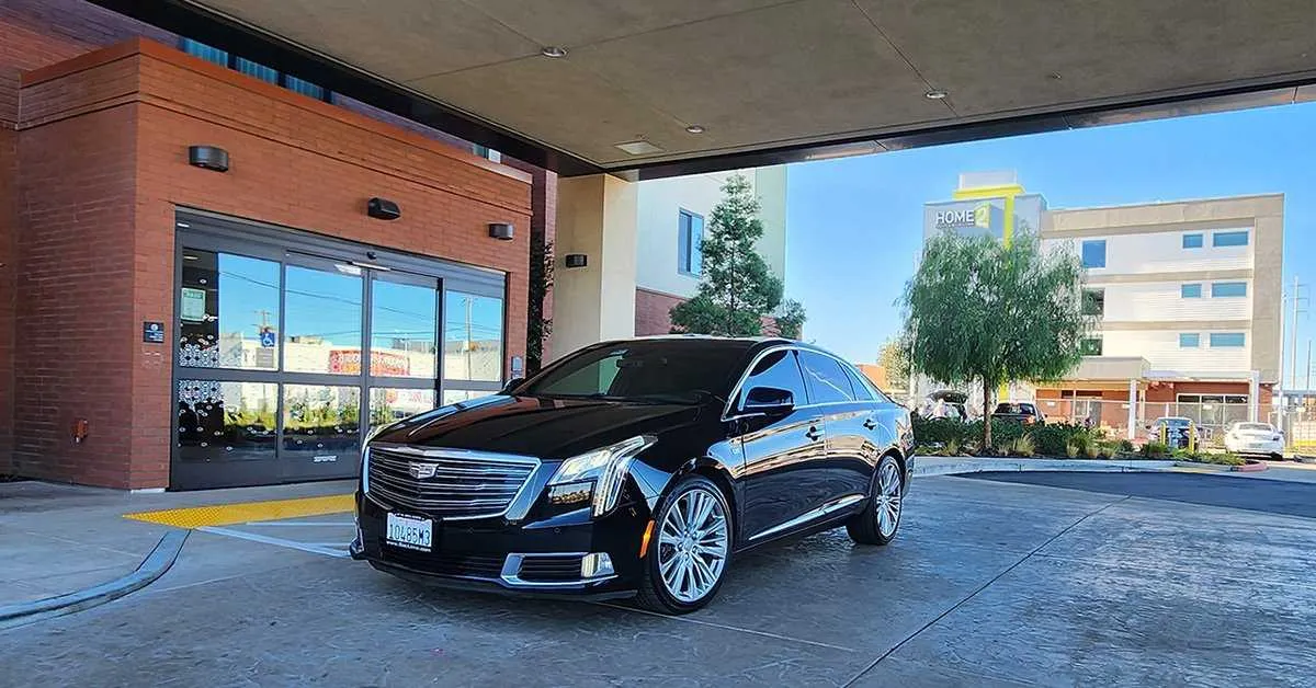 Black Cadillac XTS Platinum for sedan rental in Grass Range, MT