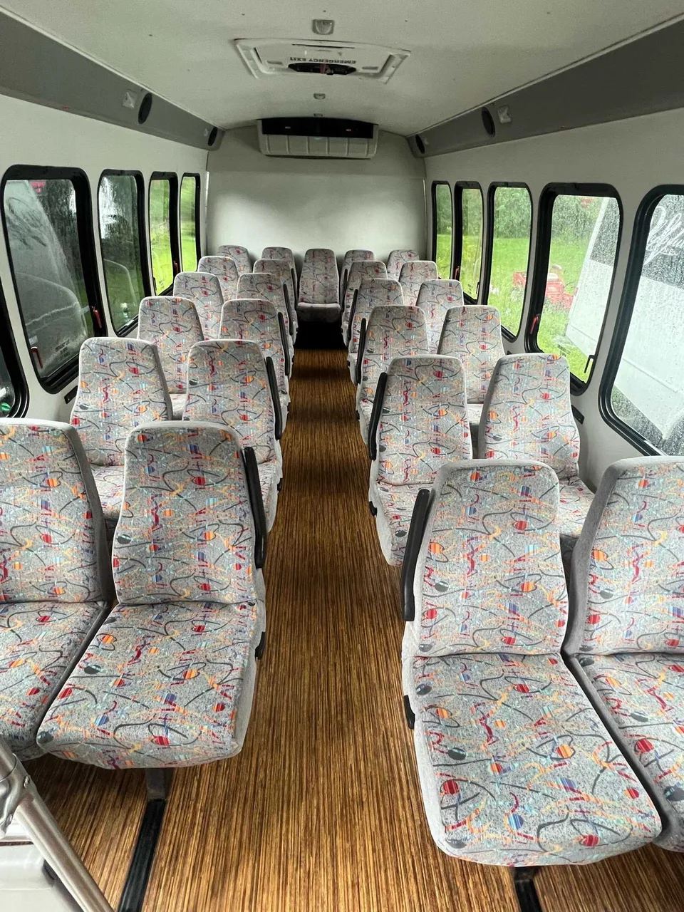 White Chevrolet C45 Shuttle Bus, photo 3 for mini coach rental in Paul Smiths, NY