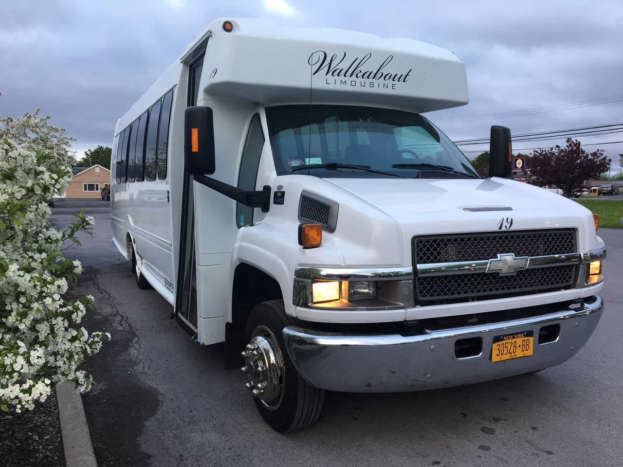 White Chevrolet C45 Shuttle Bus for mini coach rental in Paul Smiths, NY