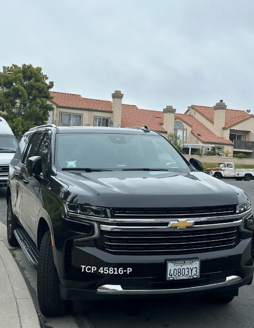 Black Chevrolet Suburban exterior with running boards for airport transfers