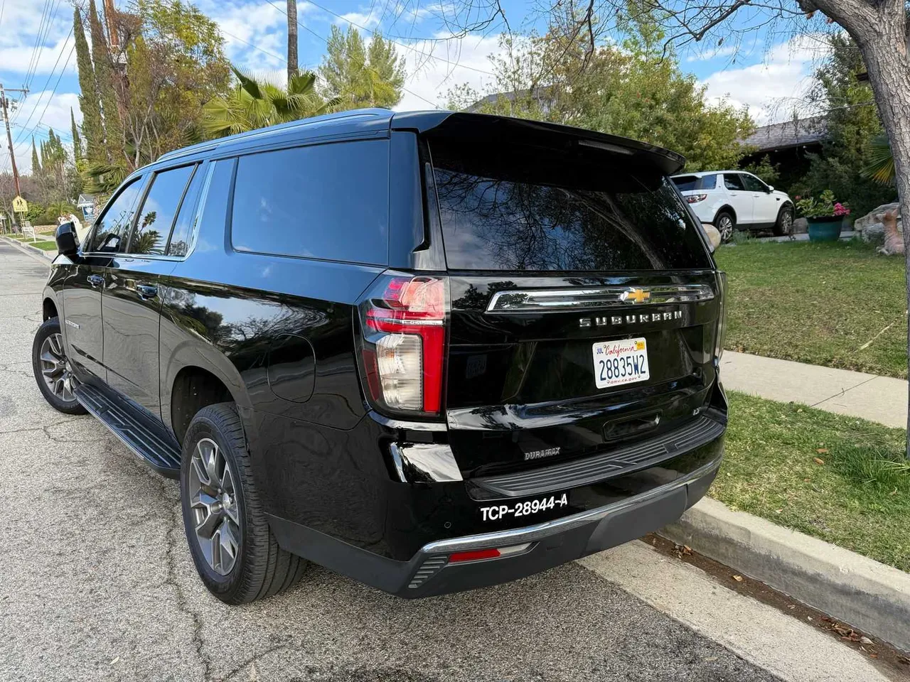 Black Chevrolet Suburban exterior with running boards for airport transfers