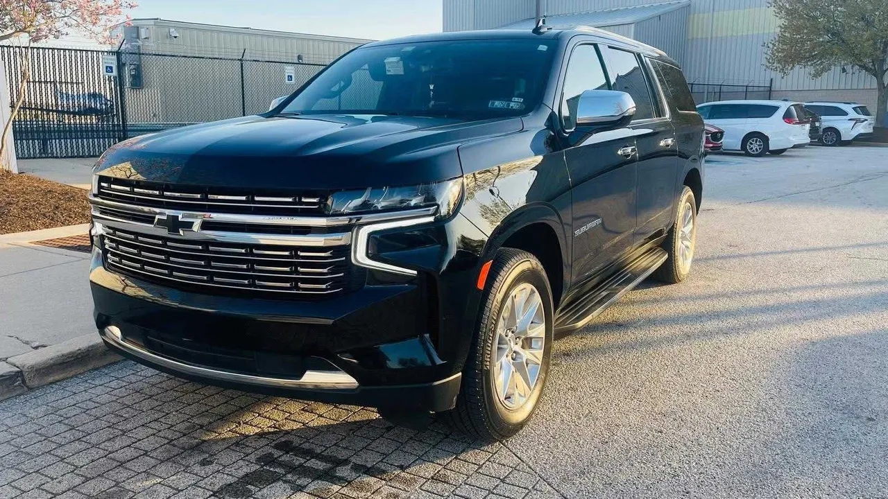 Black Chevrolet Suburban with running boards for airport transfers Black Chevrolet Suburban with running boards for airport transfers