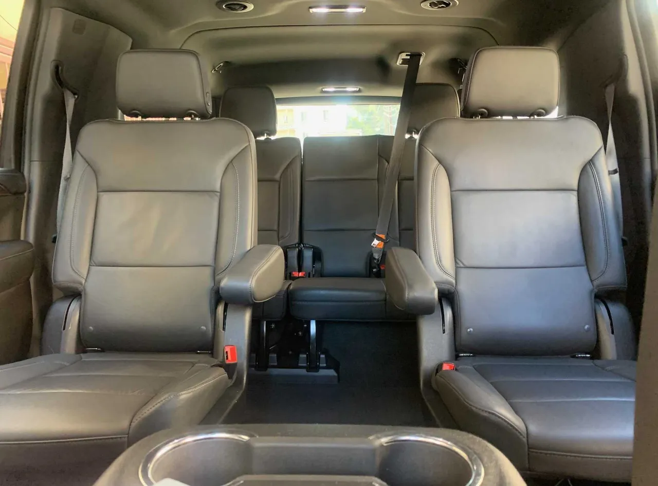 Chevrolet Suburban interior with captain's chairs and cup holders for airport transfers Chevrolet Suburban interior with captain's chairs and cup holders for airport transfers