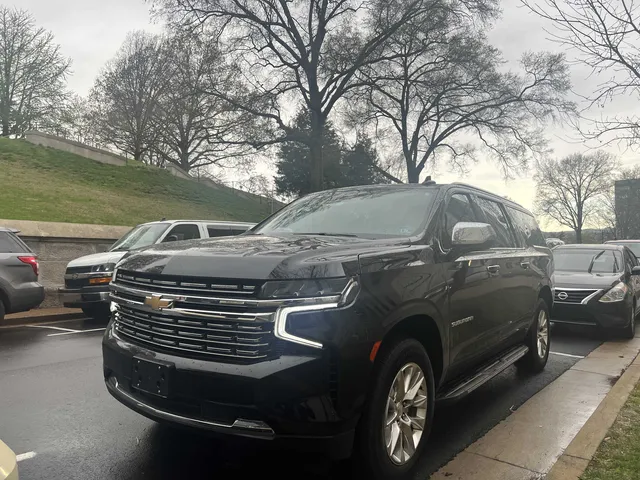 Black Chevrolet Suburban Premier exterior with running boards for airport transfers Black Chevrolet Suburban Premier exterior with running boards for airport transfers