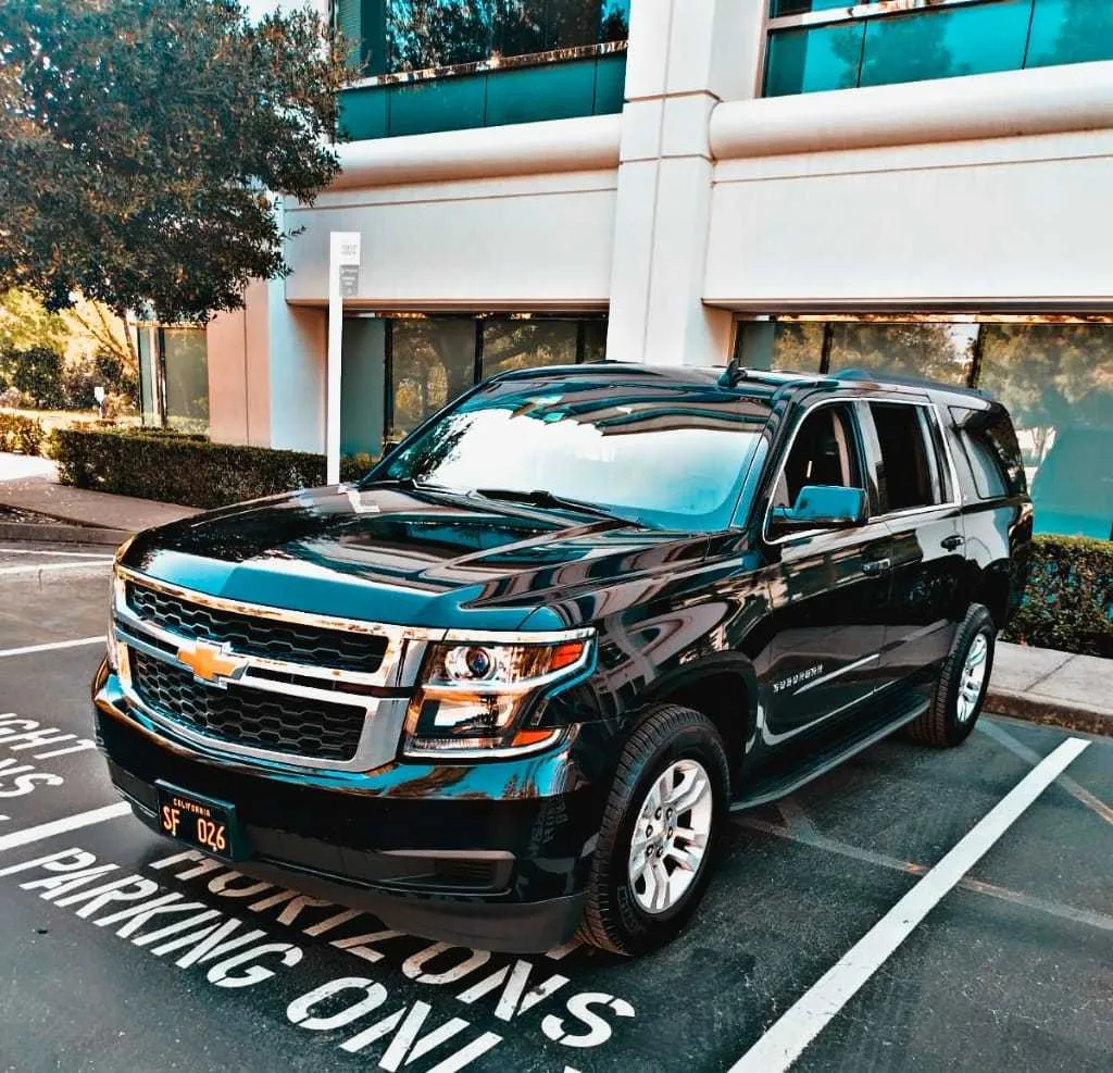 Black Chevrolet Suburban Premier Luxury SUV exterior for winery tour transport in Contra Costa County, CA