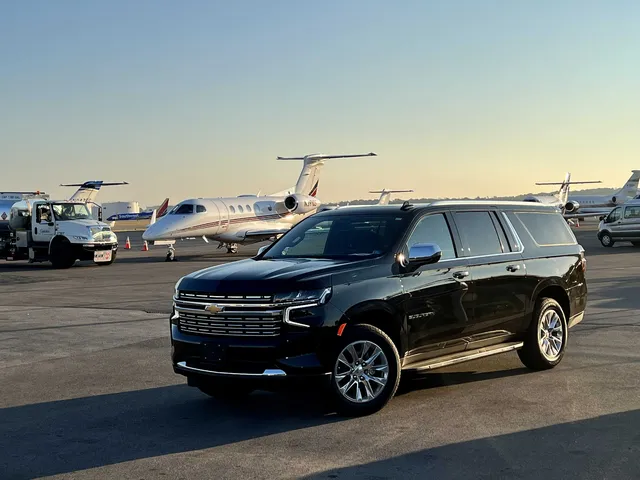 Black Chevrolet Suburban Premier with running boards for airport transfers Black Chevrolet Suburban Premier with running boards for airport transfers