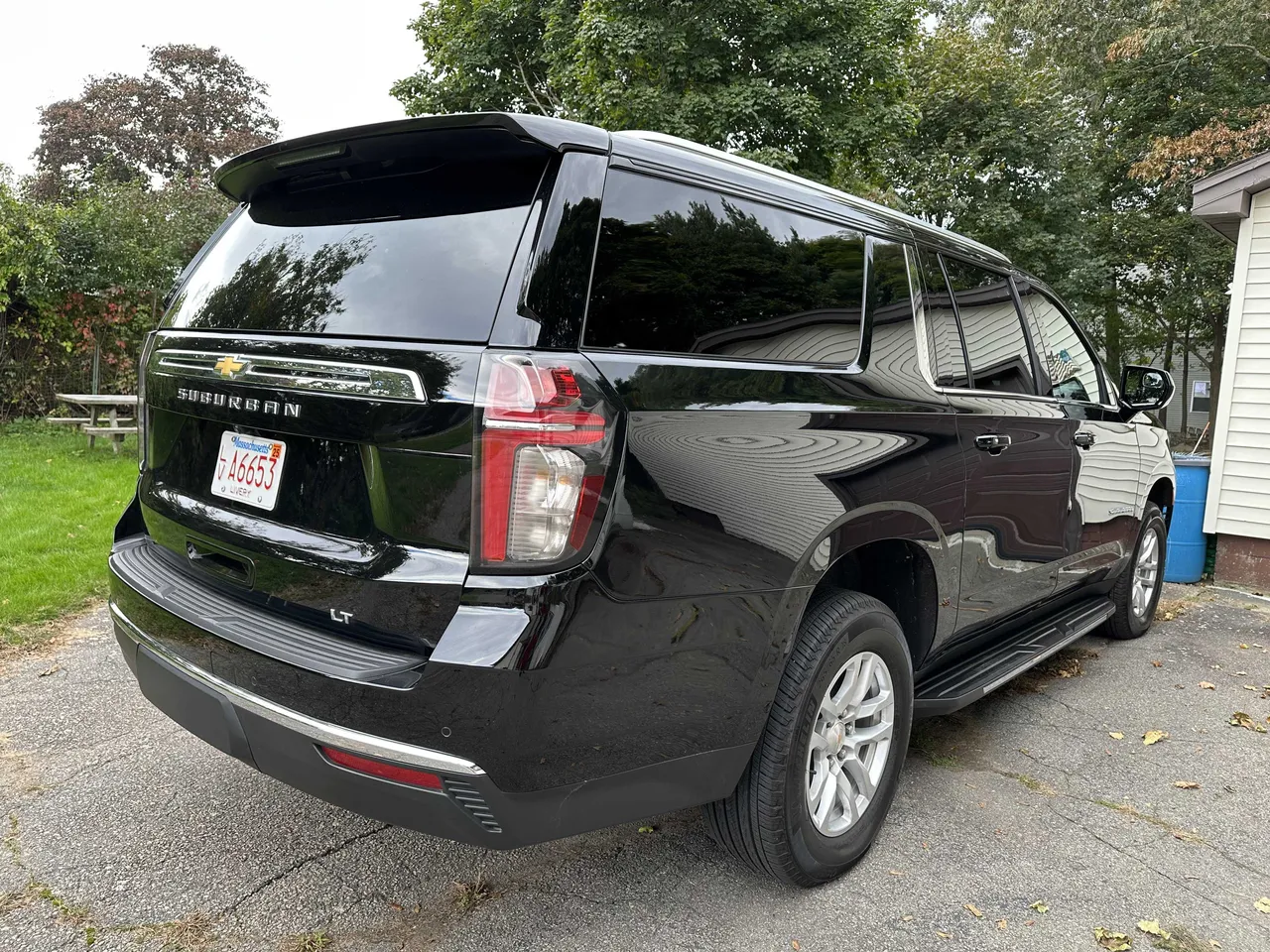 Black Chevrolet Suburban exterior with tinted windows and running boards for airport transfers Black Chevrolet Suburban exterior with tinted windows and running boards for airport transfers