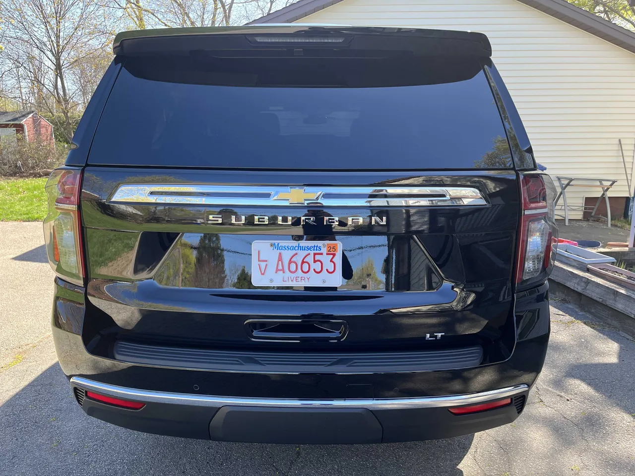 Black Chevrolet Suburban exterior with tinted windows for airport transfers Black Chevrolet Suburban exterior with tinted windows for airport transfers
