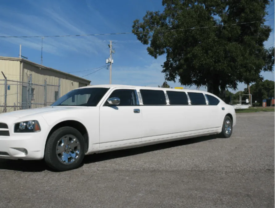 White Dodge Charger with tinted windows for limo rental