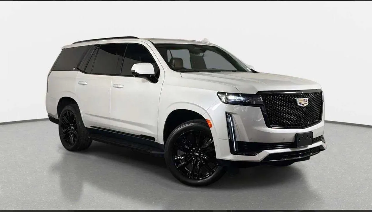 White Cadillac Escalade Platinum for airport transfers