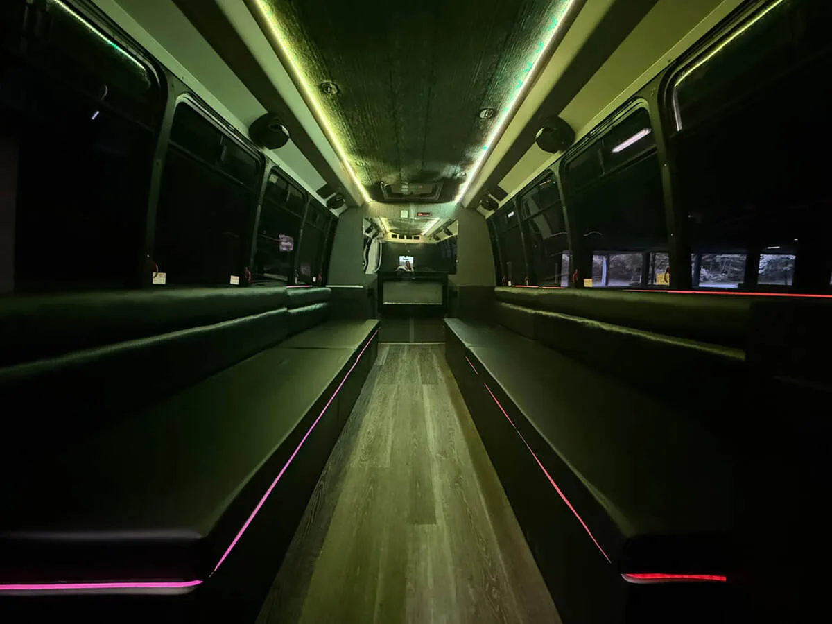Ford E-450 Series Party Bus interior with perimeter lounge seating, LED accent lighting and LED ceiling lighting, photo 3 for party bus rental Ford E-450 Series Party Bus interior with perimeter lounge seating, LED accent lighting and LED ceiling lighting, photo 3 for party bus rental