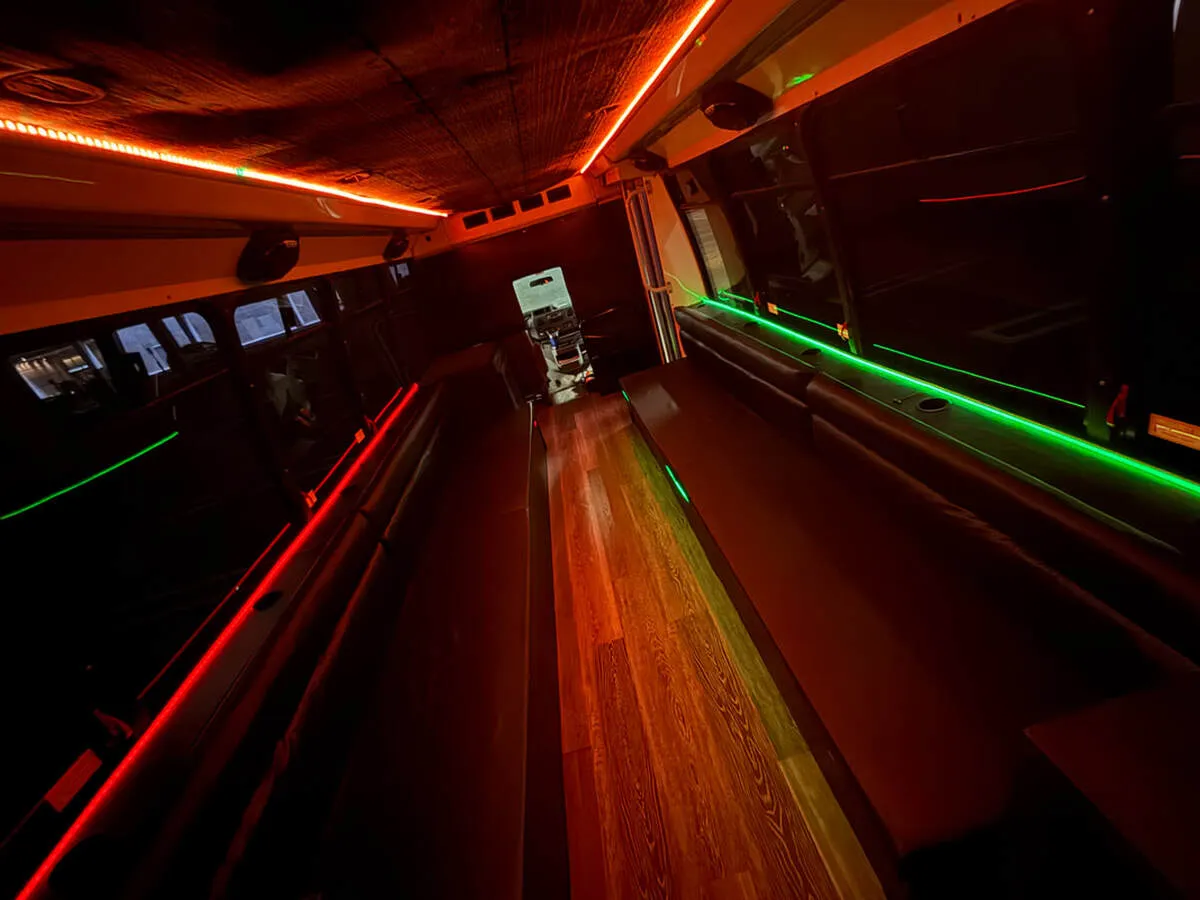Ford E-450 Series Party Bus interior with perimeter lounge seating, LED accent lighting and LED ceiling lighting, photo 4 for party bus rental Ford E-450 Series Party Bus interior with perimeter lounge seating, LED accent lighting and LED ceiling lighting, photo 4 for party bus rental