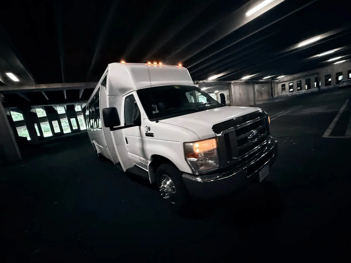 White Ford E-450 Series Party Bus exterior, photo 6 for party bus rental White Ford E-450 Series Party Bus exterior, photo 6 for party bus rental