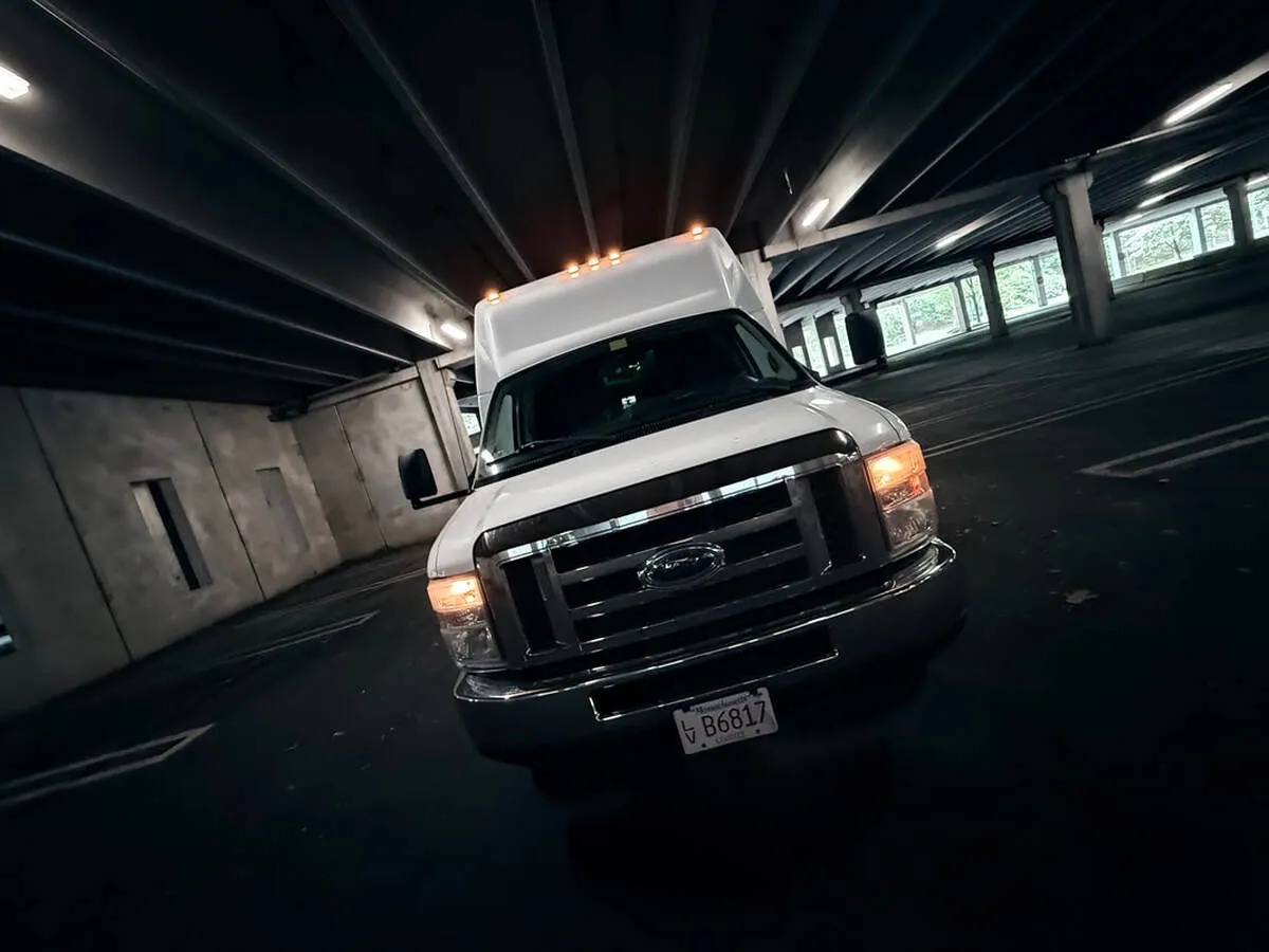 White Ford E-450 Series Party Bus exterior for party bus rental White Ford E-450 Series Party Bus exterior for party bus rental
